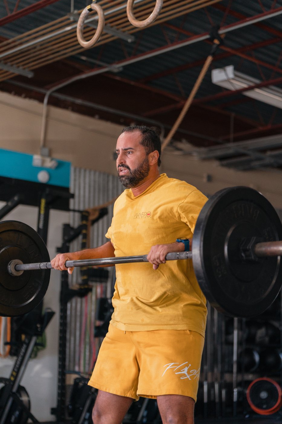 RFC athlete lifting a barbell