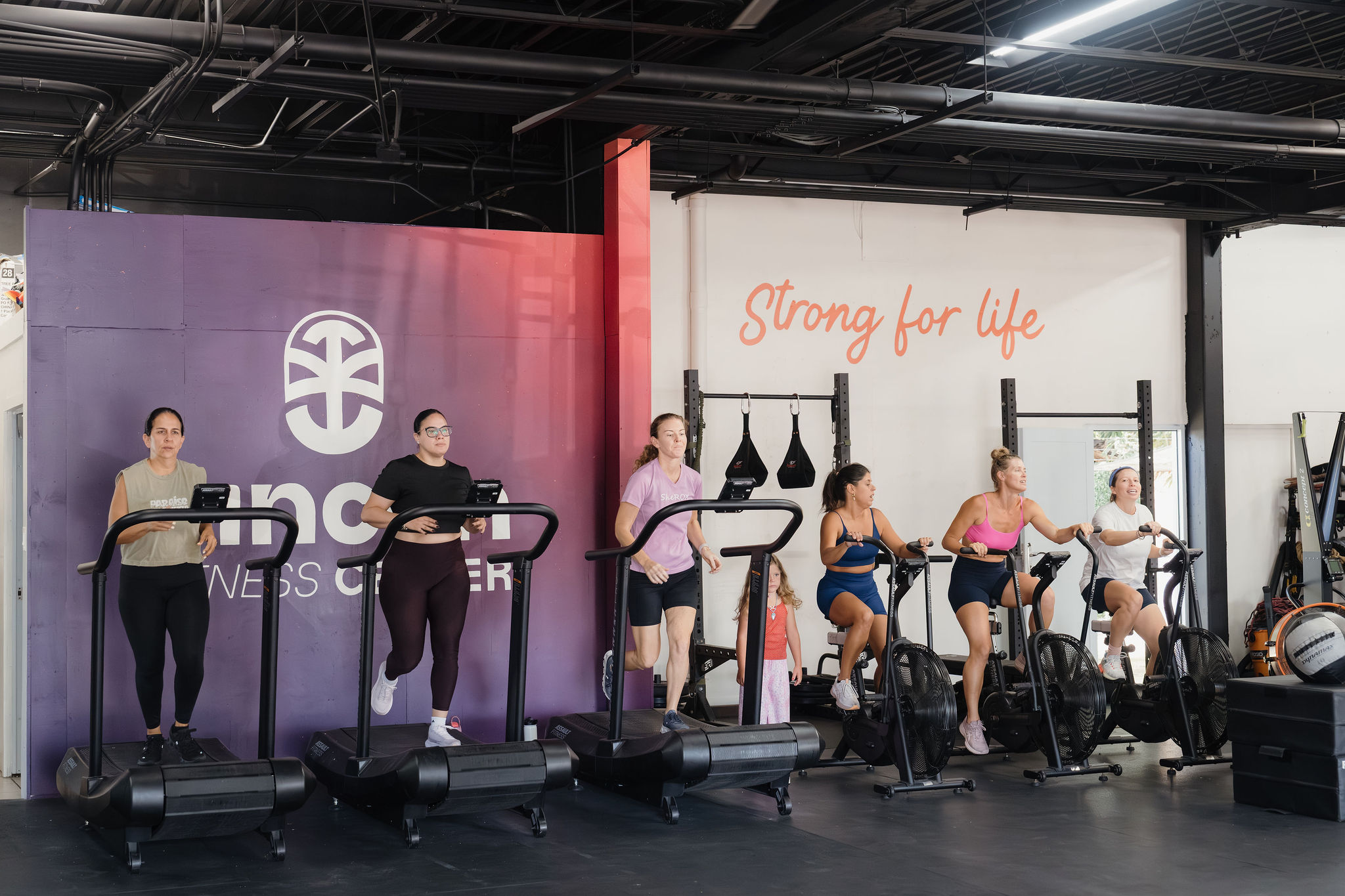 Members training together in a high-energy SWEAT Bootcamp class