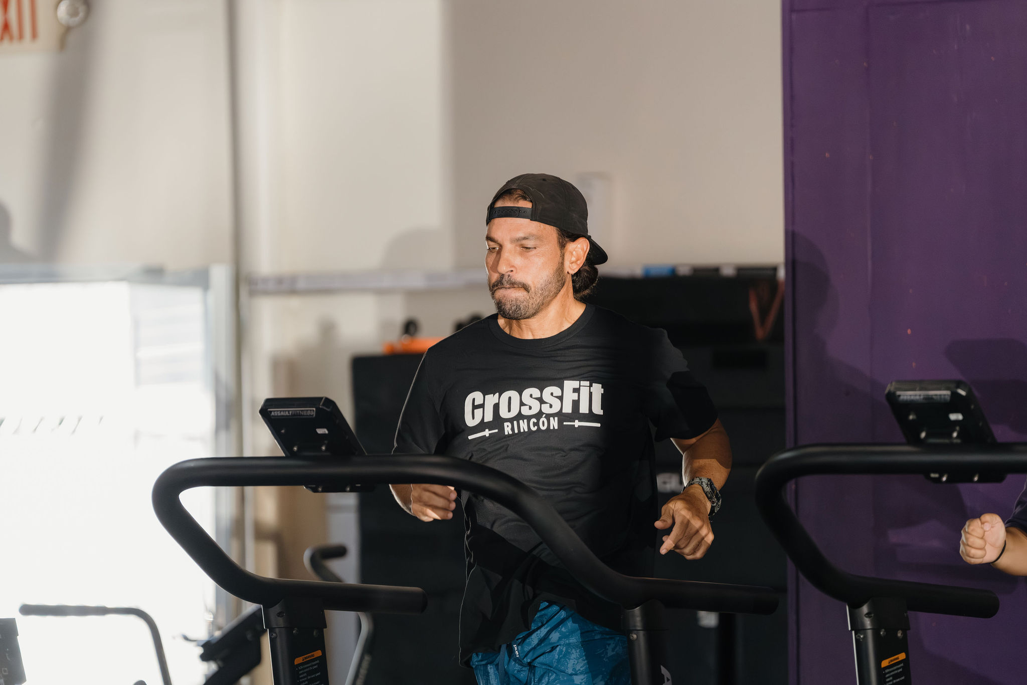 RFC member running on the assault runner in a CrossFit Rincón shirt