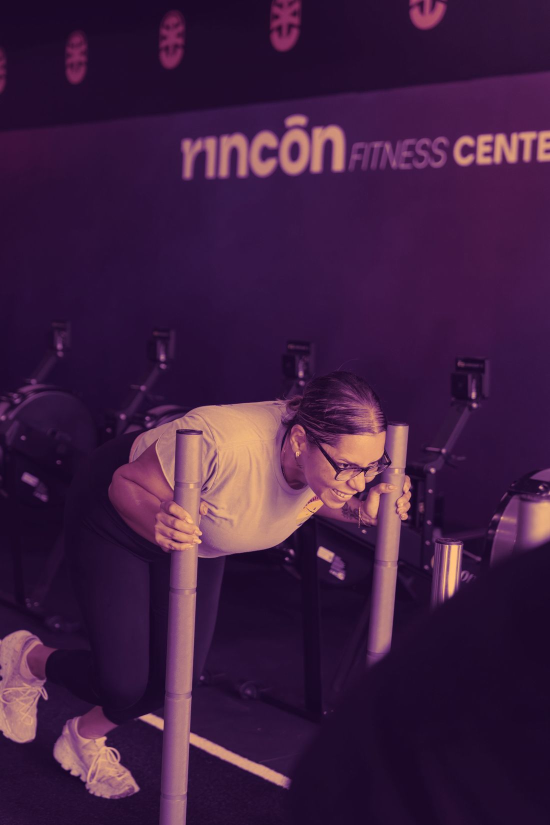 RFC athlete driving a sled push down the gym floor